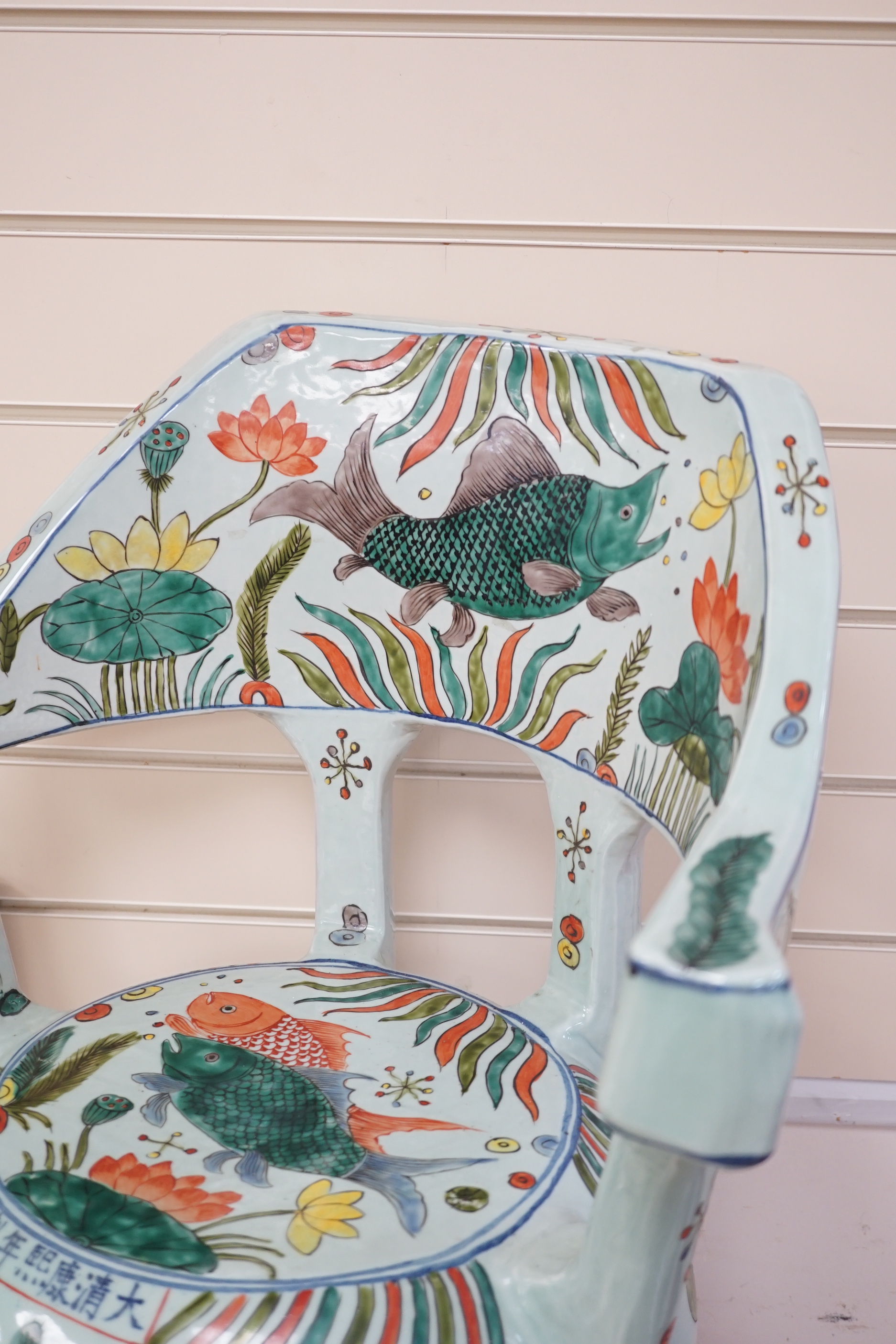 A Chinese famille verte porcelain ‘fish pond’ garden seat, 65cm high